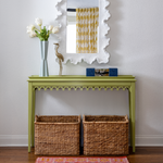 Coastal entry home decor console table in lime green with white scalloped mirror and bright carpet runner
