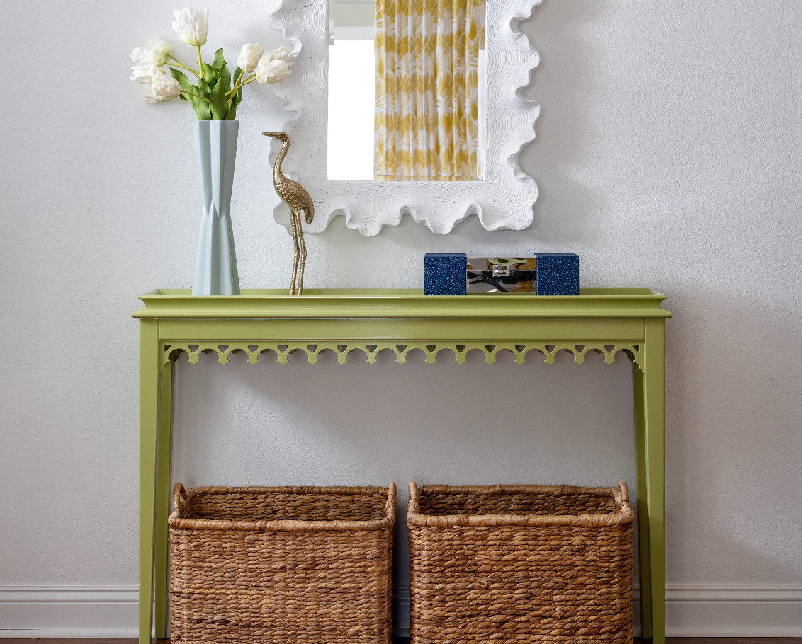 Coastal entry home decor console table in lime green with white scalloped mirror and bright carpet runner